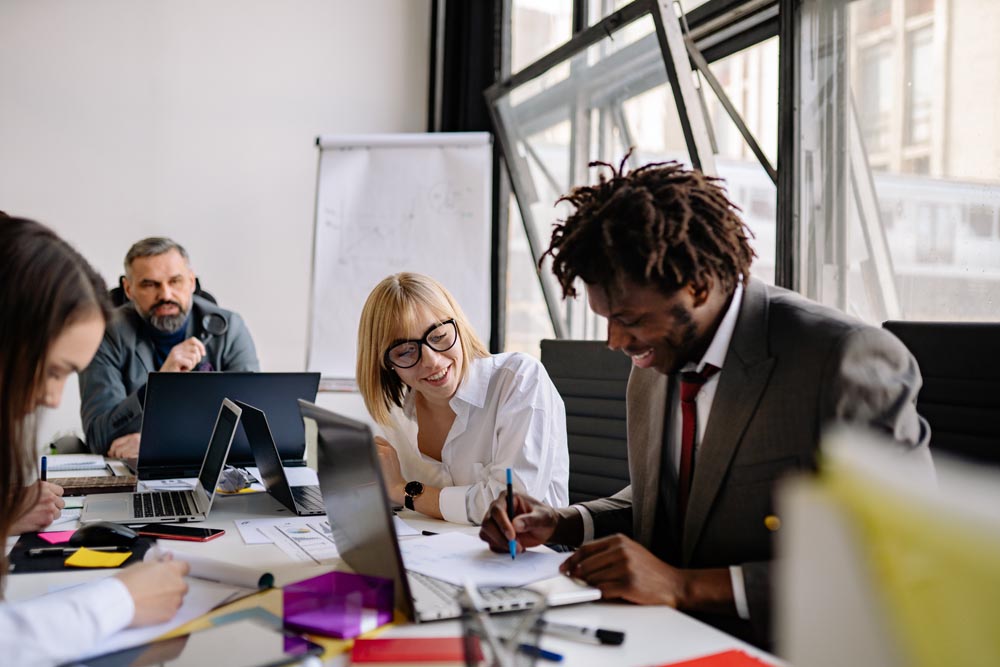 People smiling in a meeting